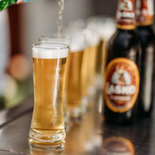glasses and a bottle of beer