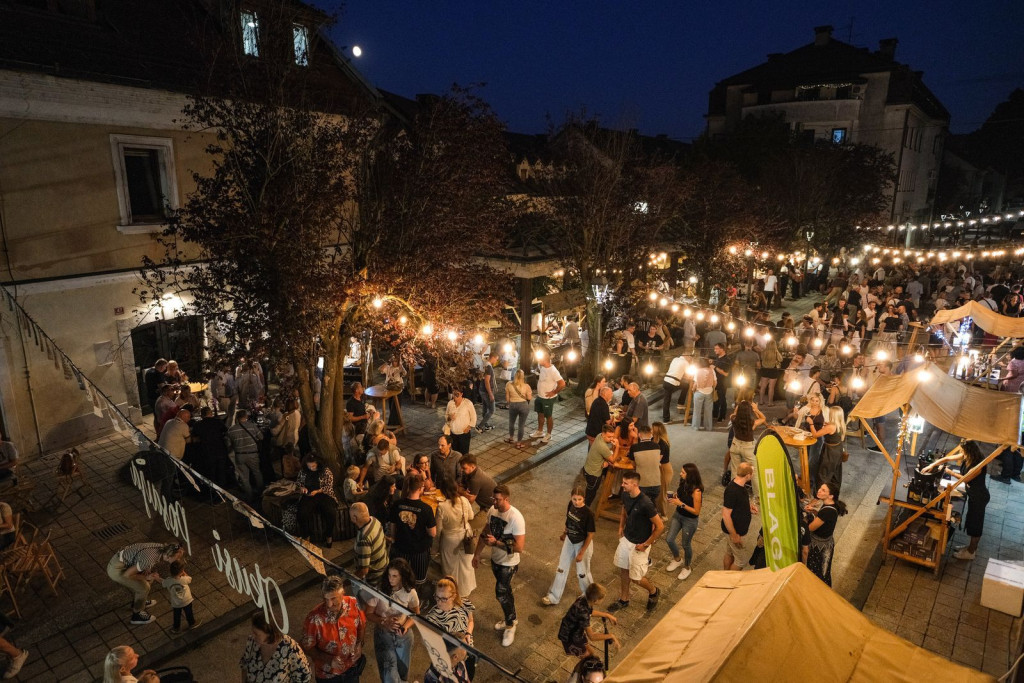 Visitors enjoying Taste Posavje street food festival in Krško old town, Slovenia