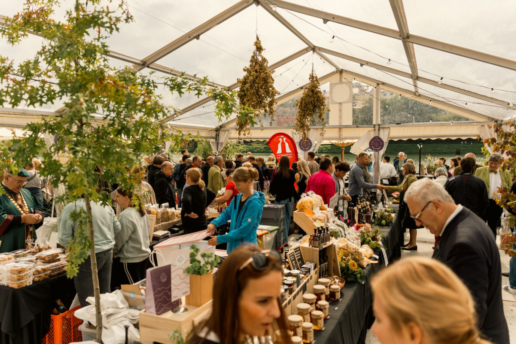 Visitors exploring local products at the Old Vine Festival in Maribor