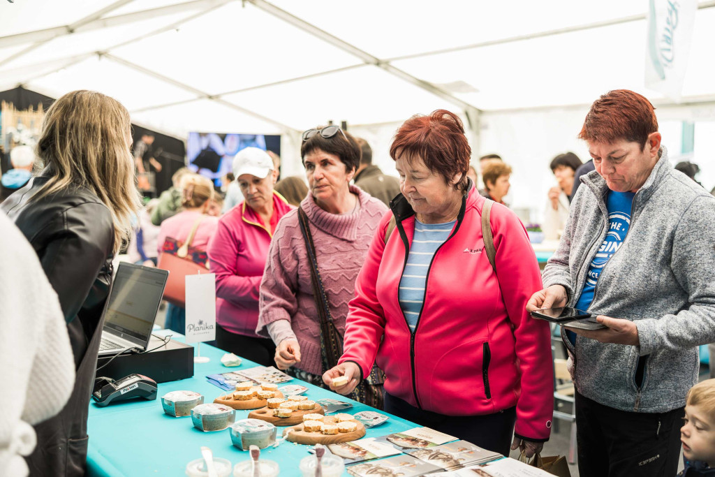 Guests tasting trout dishes at the festival