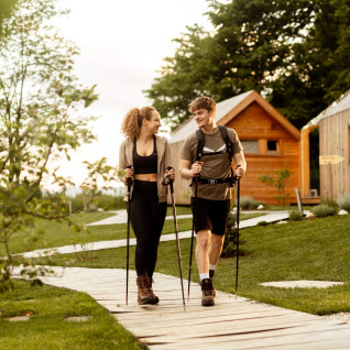 Young couple hiking in Glamping Mountain Fairy tale in Tržič