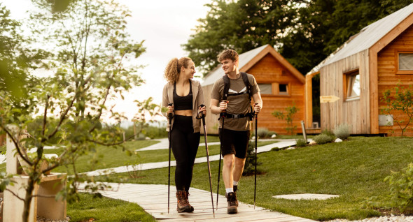 Young couple hiking in Glamping Mountain Fairy tale in Tržič