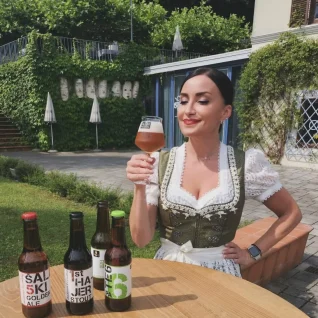Person tasting local beers in Vila Bianca