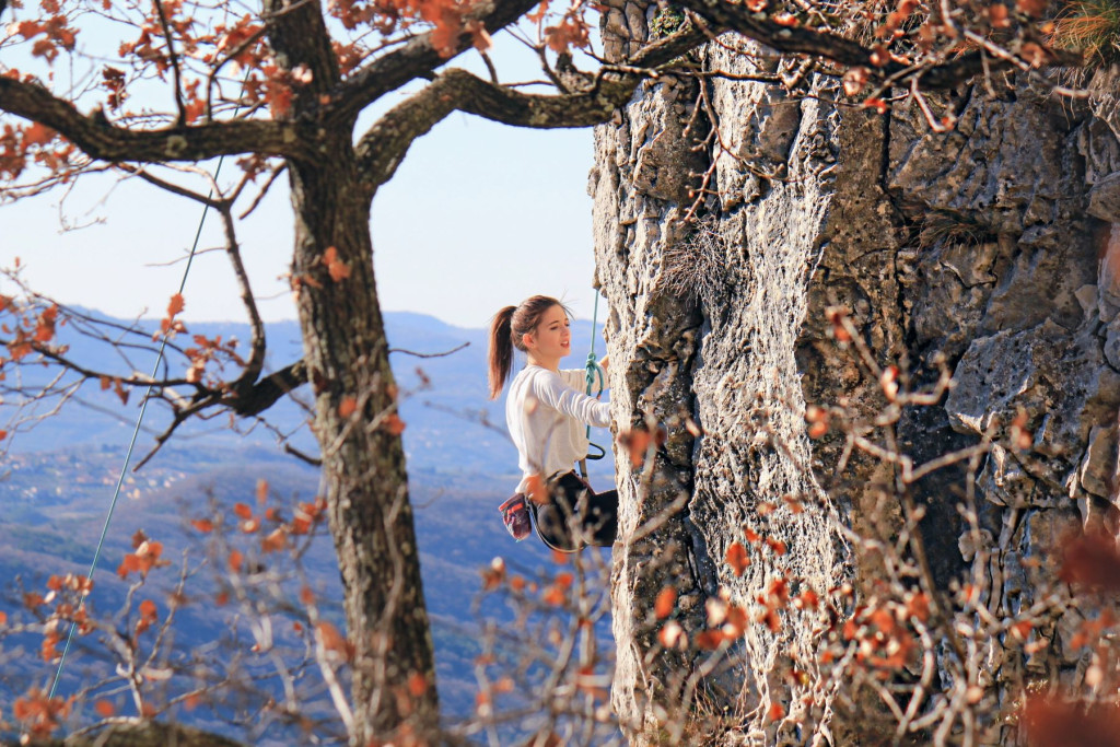 A climber on a rock at Weekends on the Edge near Koper