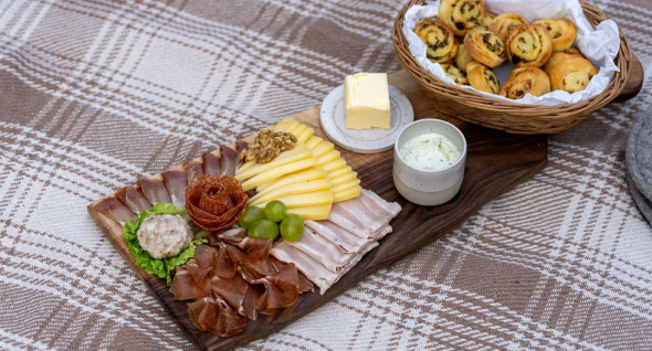 Idrija local delicacies on a picnic blanket