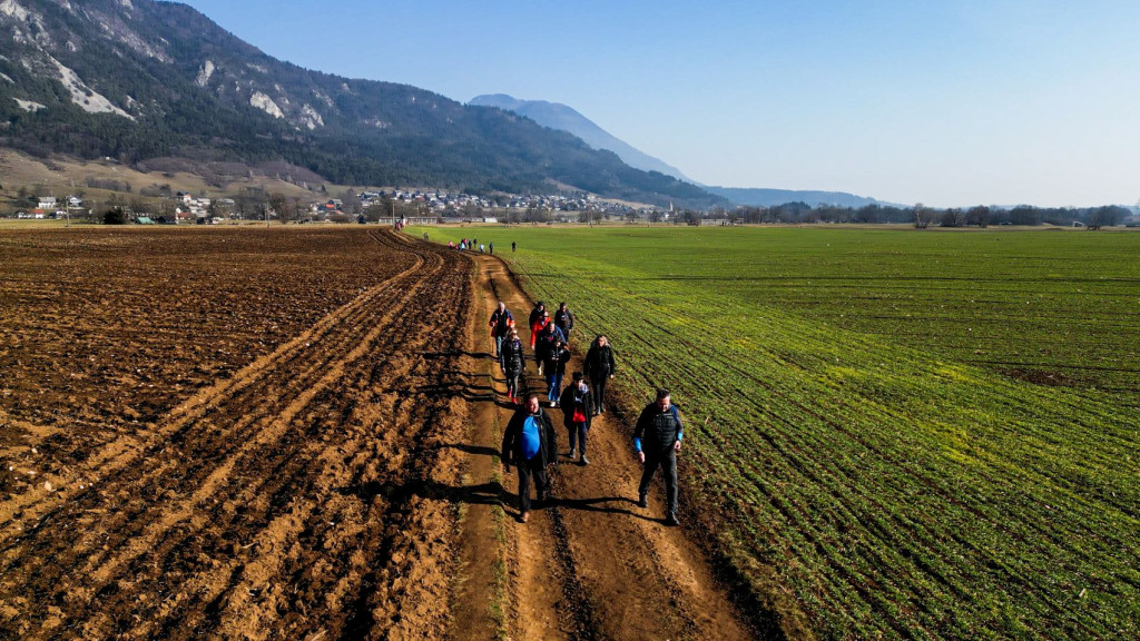 Participants walking along the Cultural Heritage Trail in Žirovnica, Slovenia, during the traditional February hike.